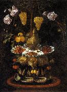 A fountain of grape vines, roses and apples in a conch shell